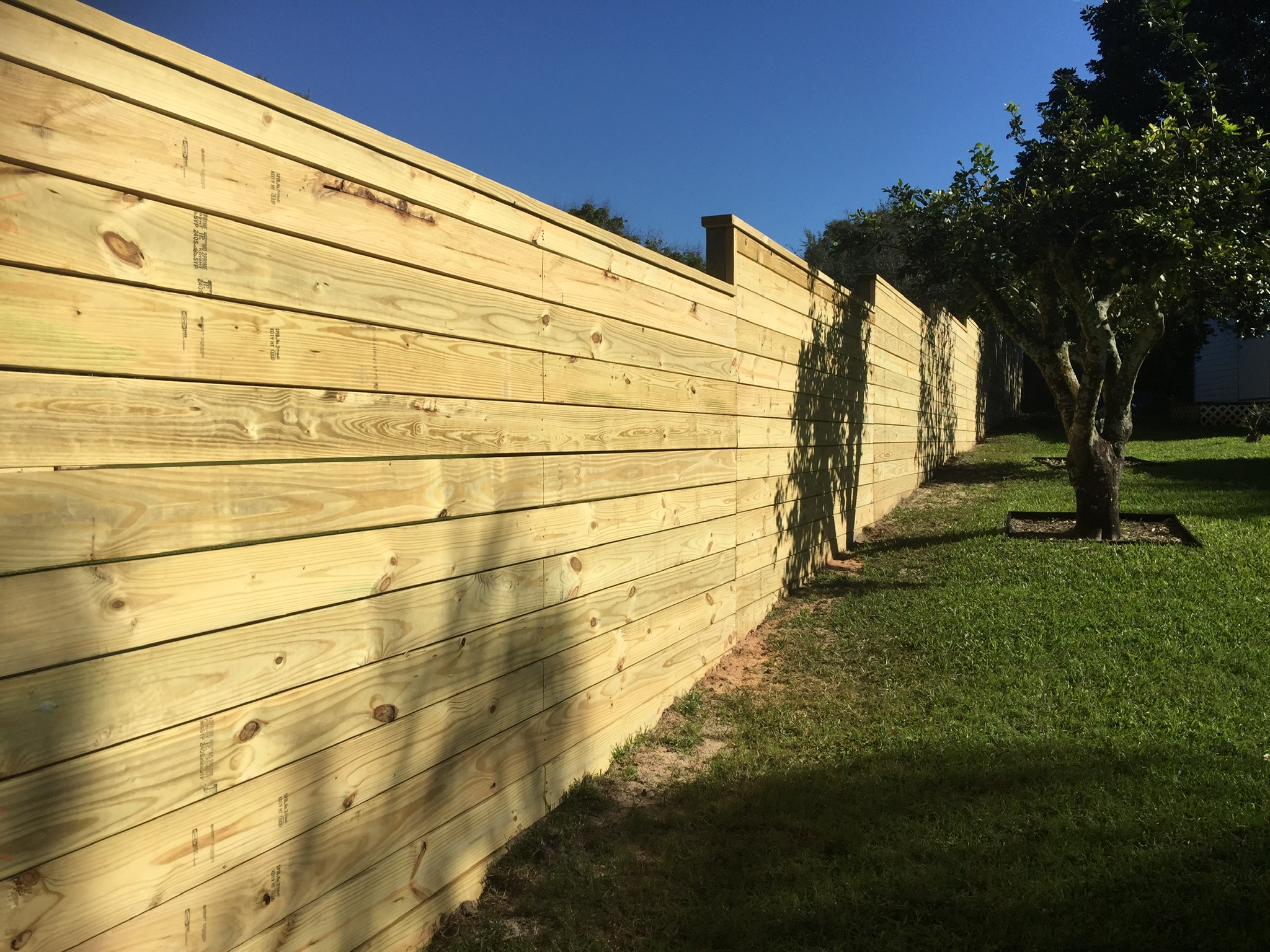 DIY Jobs: Premade Fence Panels vs. Stick Built Fences - The American Fence  Company